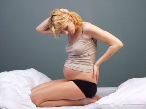 У беременной тянет поясницу